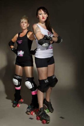 Let it roll: roller derby competitors Gori Spelling, left, and Fisti Cuffs in Melbourne.