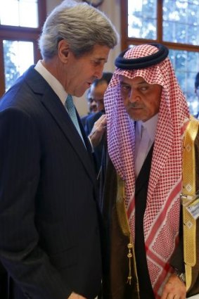 Hedging their bets: US Secretary of State John Kerry with Saudi Foreign Minister Prince Saud al-Faisal in Montreux on January 22. Mr Kerry reportedly told the Saudi king in November that the US had done the minimum it could in response to the overthrow of Egypt's elected government.