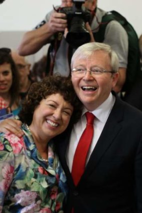 Prime Minister Kevin Rudd casts his vote with his wife Therese Rein in Brisbane.