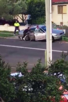 A police officer was allegedly dragged for 20m down a western Sydney street during an arrest on Friday. 