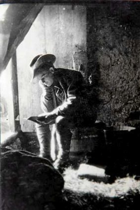 Private George Griffin in a barn in France with his diary.