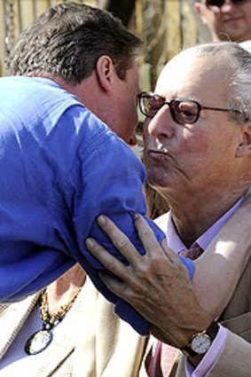 David Cameron embraces his father, Ian, during an election rally in April.