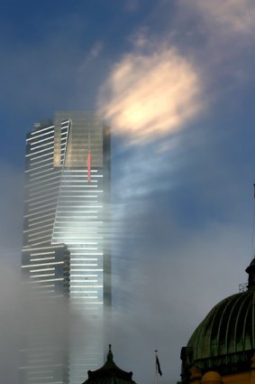 A hazy future? Fog and reflected sunlight around the Eureka Tower in Melbourne yesterday morning.
