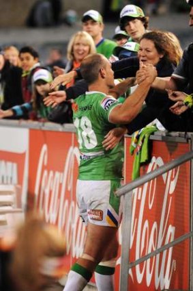 Raiders player Terry Campese hugs his mum after his return from injury.