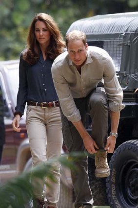 Keeping a low profile ... Kate and William in Borneo yesterday.
