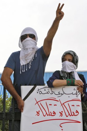 Uproar ... these students' banner says, "Last night Tehran dormitory, killing fields".