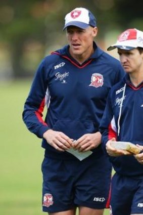 On the road to glory: Roosters assistant coaches Craig Fitzgibbon and Jason Taylor in 2013.