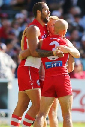 Lance Franklin celebrates with teammates during the match against Adelaide on Saturday.