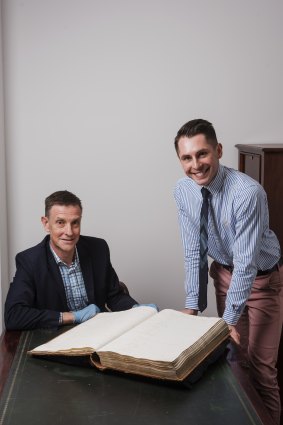 Martyn Killion, director, Collections, Access & Engagement and NSW State Archives’ Executive Director Adam Lindsay with the 1828 Census from the State Archives Collection.  Mr Killion's great great grandmother Charlotte Mason is listed. 