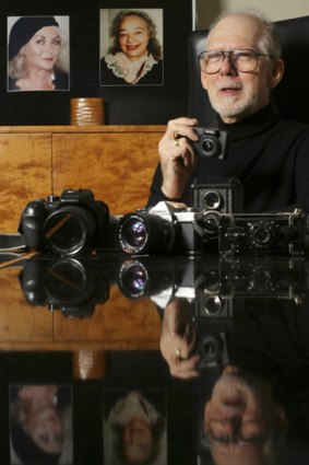 John Hoerner at home with some his cameras and photographs.
