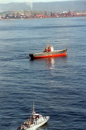 An illegal ship off Wollongong being guarded by the patrol boat Fremantle.