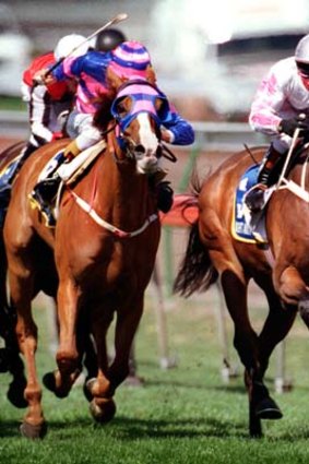 Close finish ... Might and Power, right, claims the 1997 Melbourne Cup.