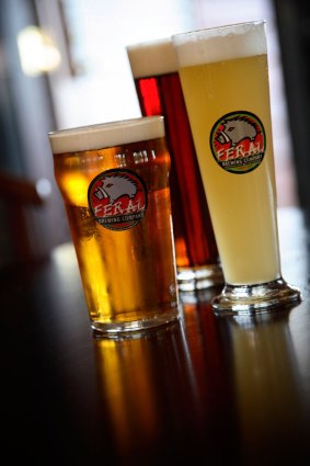 A pint alongside a schooner glass.