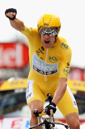 Victory: Britain's Bradley Wiggins punches the air on winning a stage in last year's Tour de France.