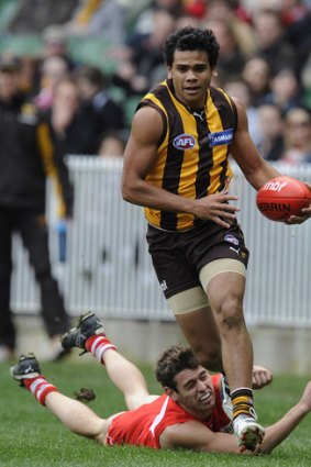 Catch me if you can: Former schoolmates Cyril Rioli and Nick Smith in action in the AFL.