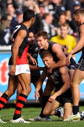 Marc Murphy and his Carlton teammates celebrate a goal. Murphy was best afield with 37 disposals and a goal.