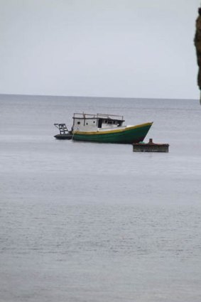 The asylum seekers' boat that arrived in rough seas on Sunday.