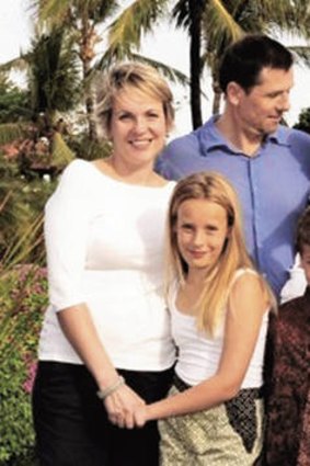 Tanya Plibersek, pictured with her family, has defended the government's decision to reduce the payment from $5000 to $3000 for second and subsequent children.