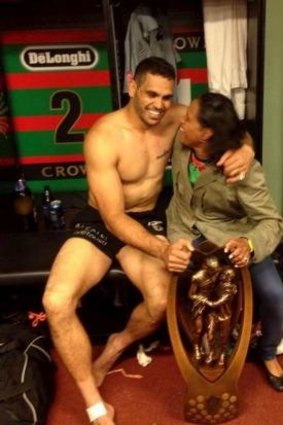 Inspirational: Cathy Freeman joins Greg Inlis with the NRL trophy in the South Sydney dressing room.