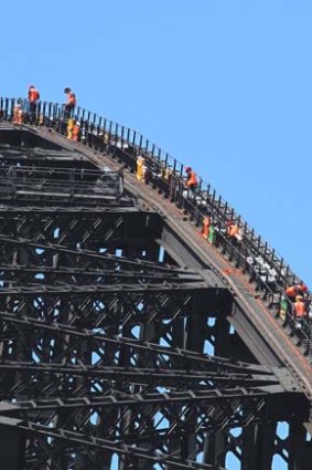 Countdown: Harbour Bridge technicians set up the New Year's Eve fireworks.