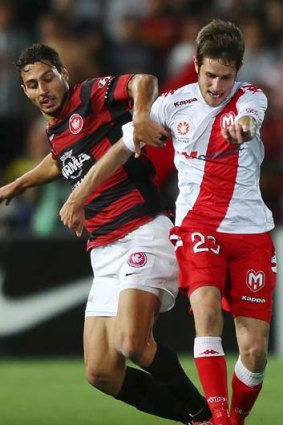 The accountant &#8230; Adam D'Apuzzo gets to grips with Melbourne Heart's Mate Dugandzic.