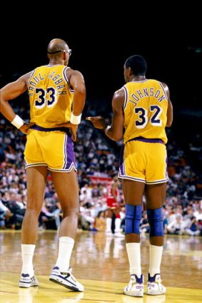 Los Angeles Lakers legends Kareem Abdul-Jabbar and  Magic Johnson during an NBA game at the Great Western Forum in Los Angeles, California in 1988.