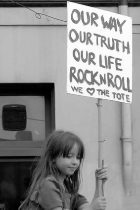 A young supporter of the Tote  protesting the pub's closure.