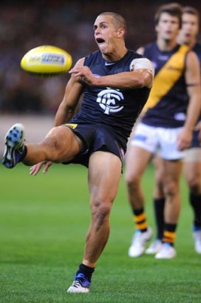 Ed Curnow gets a kick away for the Blues against Richmond.