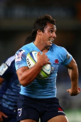 Nick Phipps of the Waratahs makes a break during the round 11 Super Rugby match against the Blues.
