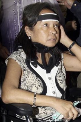 Gloria Arroyo wore a neck brace as she arrived at an airport in Manila for a flight to Hong Kong earlier this week, but was not allowed to leave the country.