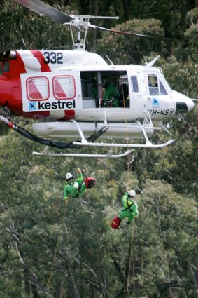 Some of the state's 28 rappel firefighters train in the bush near Mount Buller.