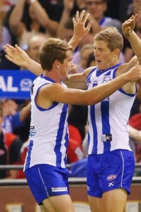 Nick Dal Santo (right) celebrates a goal against the Bombers.