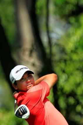 Jason Day hits his tee shot on the second hole during the final round of the 2011 Masters Tournament.