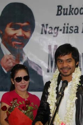 Manny Pacquiao and his wife Jinkee at the Ninoy Aquino International Airport in Manila on Wednesday.