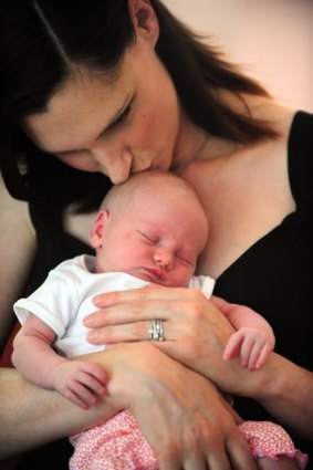 Former model Anneliese Suebert with her first child daughter Camille, 11 days old.