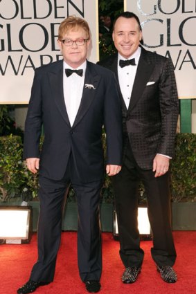 Elton John arrives at the Golden Globes with partner David Furnish.