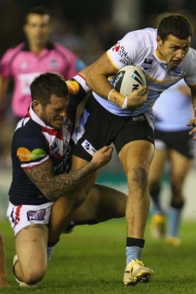 Hang around ... Blake Ferguson breaks a tackle in the Sharks' win over the Roosters on Friday night.