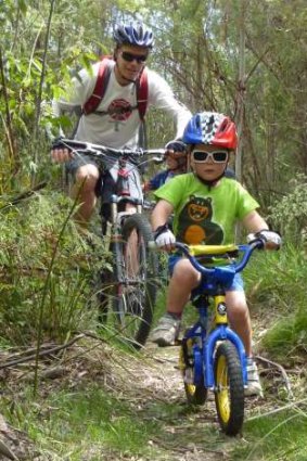 Tom McMaster and son Archie road test the new shared use tracks at Tidbinbilla