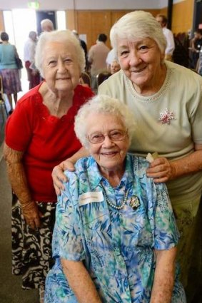 Folks from Project Love and Care held their end of year Christmas party to thank their many volunteers. From left, Mona Clarke, Dorothy Young (front), and Ann George.