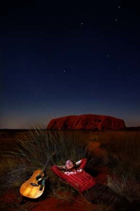 <i>Solid Rock</i> ... Shane Howard photographed with Uluru in the background.