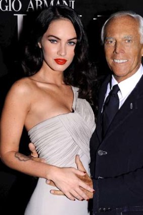 Armani with Megan Fox, the former face of his fragrances.
