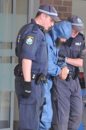 Captured ... Malcolm Naden leaves Taree Hospital after medical checks..