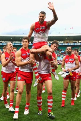 Lance Franklin of the Swans is chaired from the ground after his 200th AFL match.