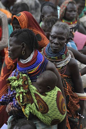 Desperate times ... women and children wait for food-aid distributions in Kenya, where food shortages have increased dramatically.