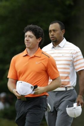 Tiger Woods trails Rory McIlroy.