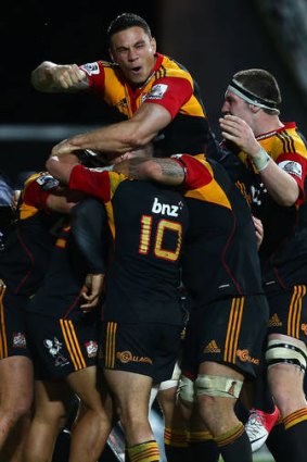 Head and shoulders ... NRL-bound Sonny Bill Williams celebrates with the victorious Chiefs.