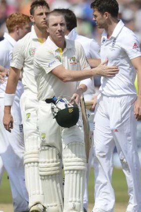 Brad Haddin pats England's James Anderson after England won the first Ashes Test.