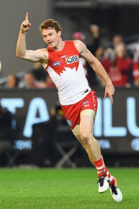 Cruise control: Gary Rohan of the Swans celebrates kicking a goal.