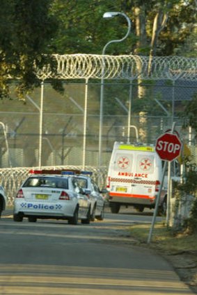 An ambulance leave Villawood Detention Centre.