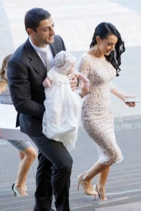 The happy family arrives at St Mary's Cathedral.